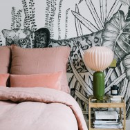 Morgane Sézalory, Paris apartment. Bedding Sézane. Palm wallpaper Bien Fait. Pink lamp India Mahdavi.
