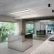 "Mirrored walls reflect the exposed concrete."