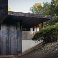 The hillside was left open and natural. The home is shaded by mature oak trees, which were integral to the design.