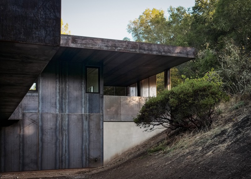 The hillside was left open and natural. The home is shaded by mature oak trees, which were integral to the design.