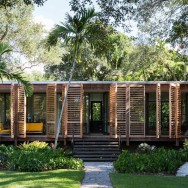 Wooden shutters wrap around this Miami home.