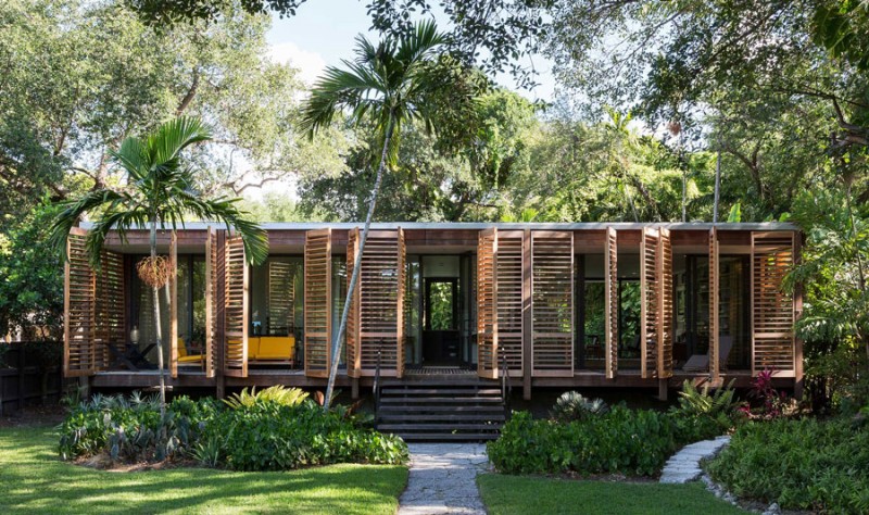 Wooden shutters wrap around this Miami home.