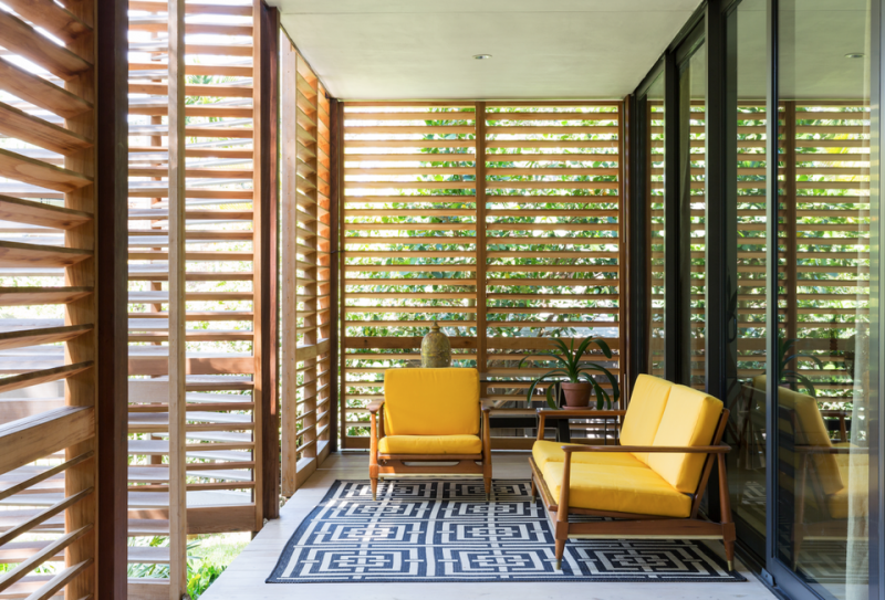 Inside, Brillhart Architects has contrasted the house’s glass walls with various types of wood, including reclaimed cherry, oak and red cypress.